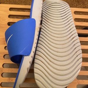 blue and white nike slides